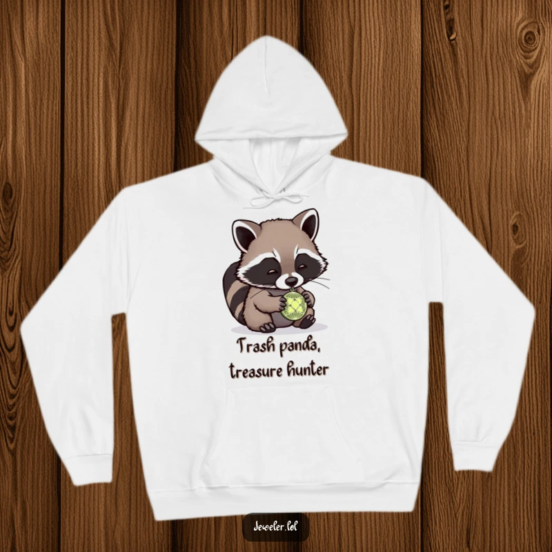 Funny raccoon hoodie showing a cute raccoon hunched over, intensely studying a tiny, intricate pendant, radiating playful curiosity and charm.