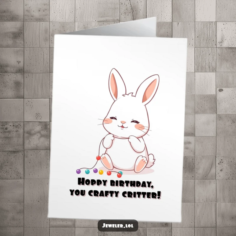Funny free printable birthday card showing a focused rabbit meticulously stringing tiny, colorful beads onto a thread.